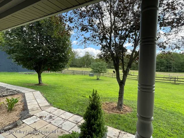 wooden floor fireplace and natural light in room