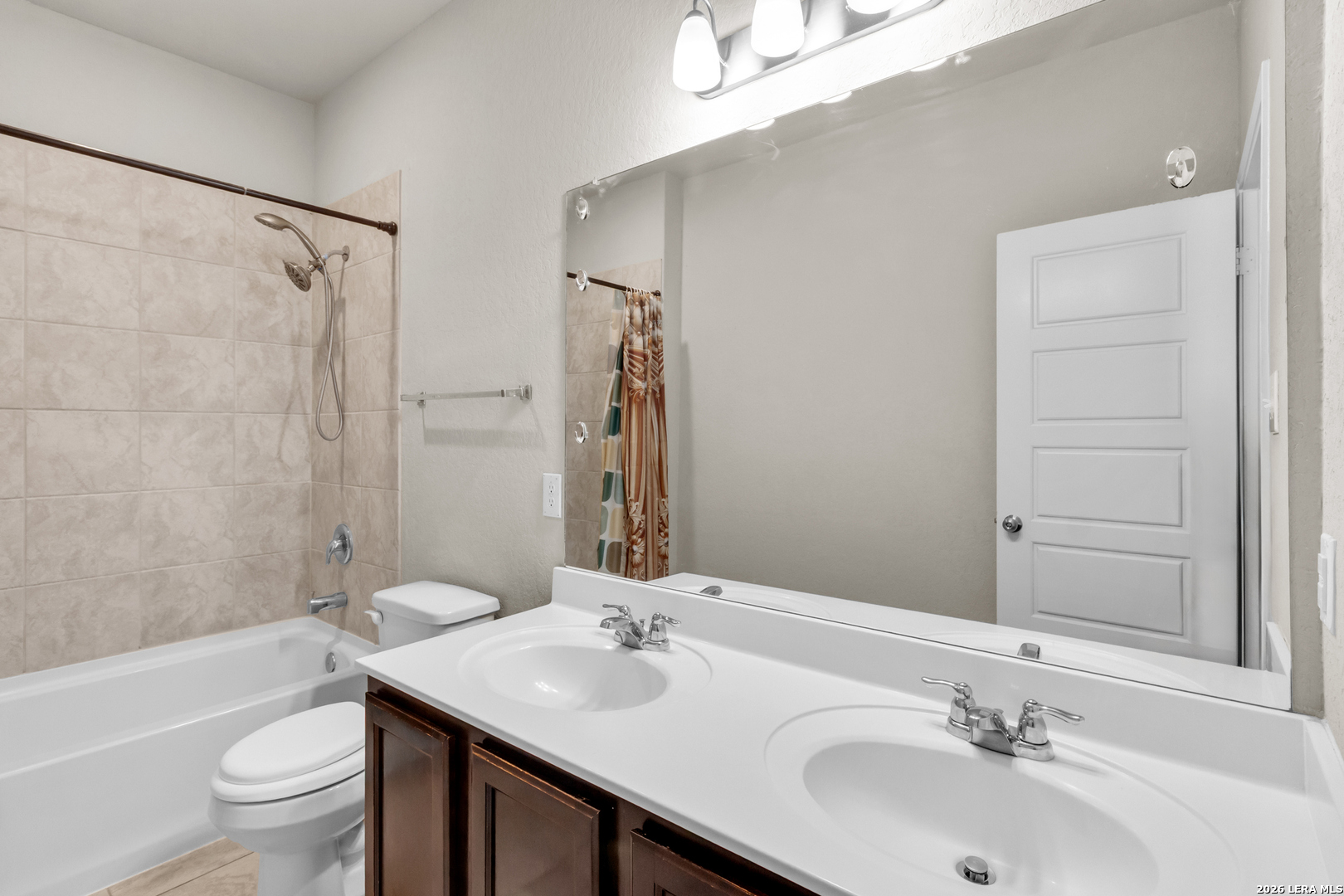 5919 Poolside Park Converse, TX 78109 - Photo 15 of 25 a bathroom with a sink and a mirror
