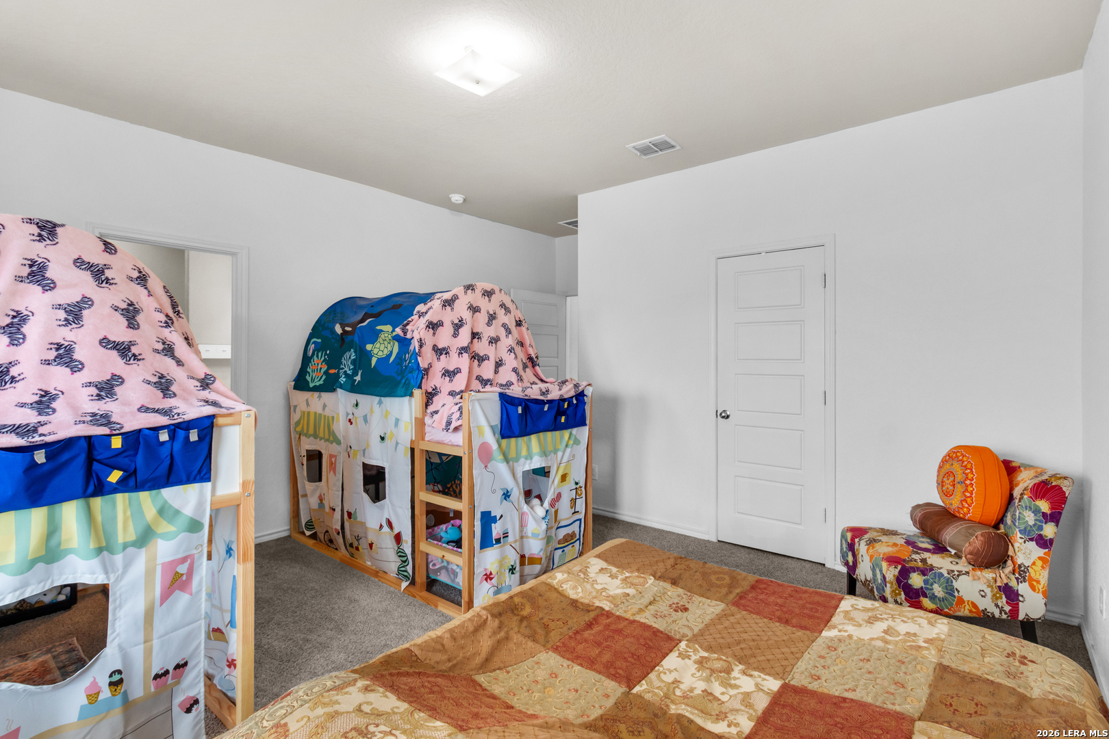 5919 Poolside Park Converse, TX 78109 - Photo 19 of 25 a bedroom with furniture and a baby crib