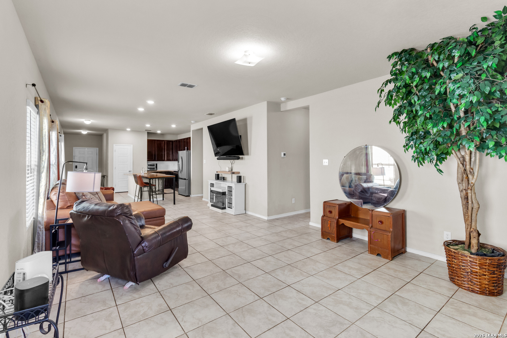 5919 Poolside Park Converse, TX 78109 - Photo 10 of 25 a living room with furniture and a flat screen tv