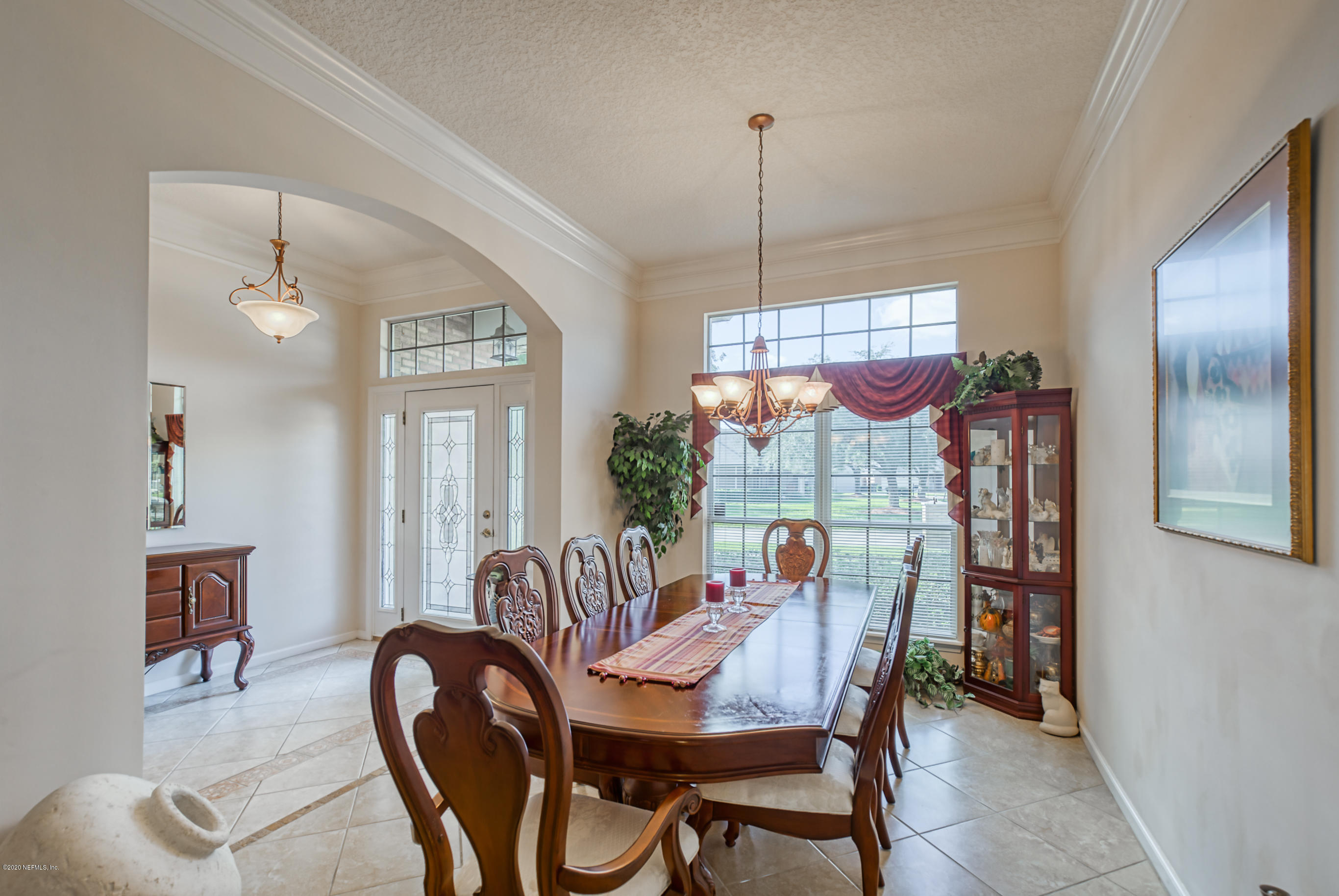 12003 Spring Ridge Drive Jacksonville, FL 32258 - Photo 4 of 33 a view of a dining room with furniture window and wooden floor