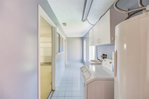 a view of storage and utility room with washer and dryer