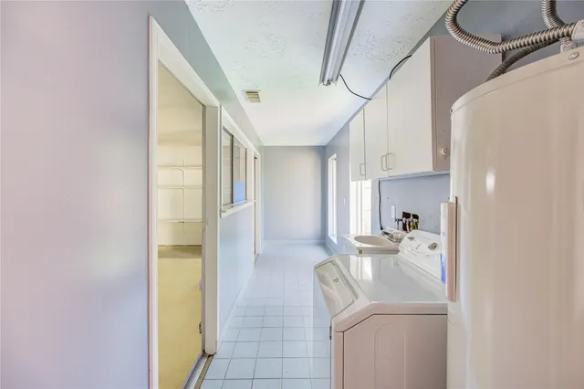 a view of storage and utility room with washer and dryer