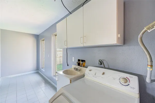 a view of a hallway with a kitchen