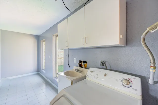 a view of a hallway with a kitchen