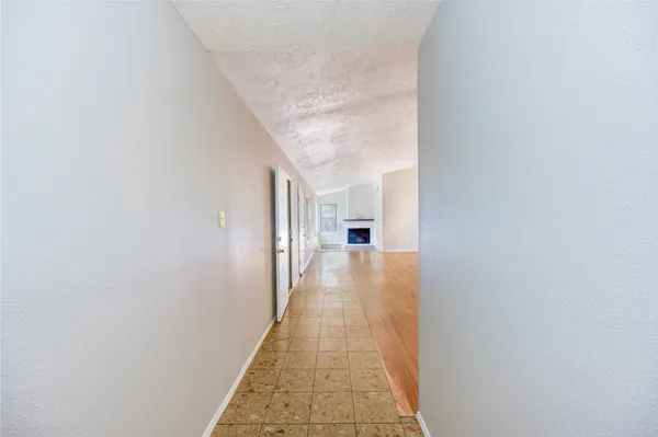 a view of a hallway with a white walls