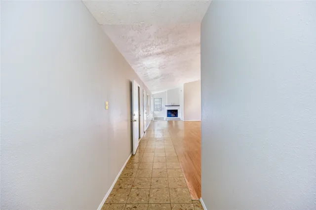 a view of a hallway with a white walls