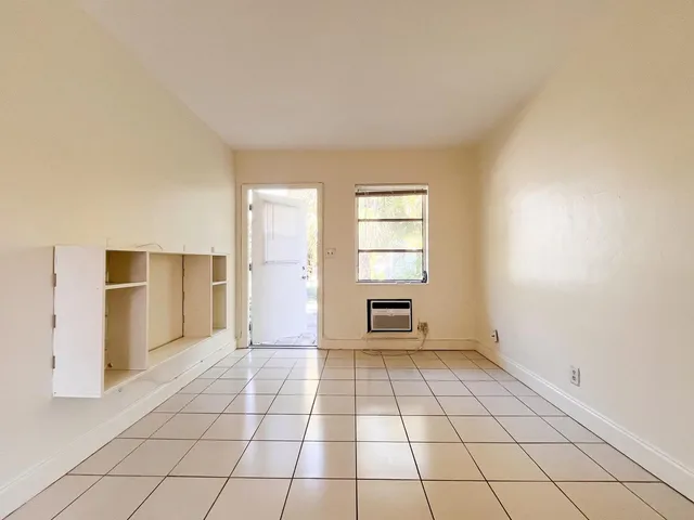 a view of an empty room and window