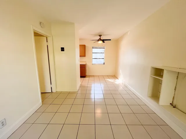 a bathroom with a sink mirror and vanity