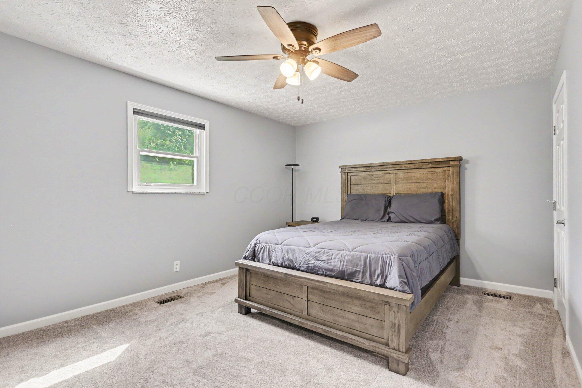 197 Helen Road Southwest Pataskala, OH 43062 - Photo 11 of 32 Primary bedroom