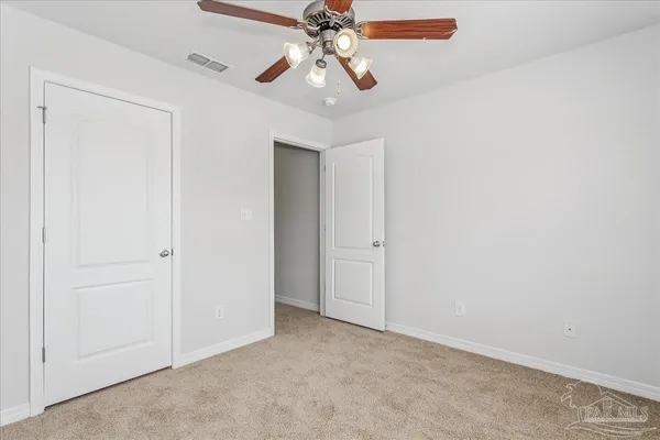a view of a chandelier fan in a room