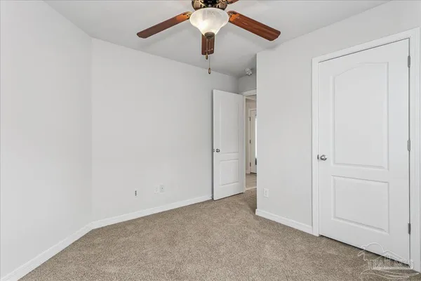a view of a chandelier fan in a room