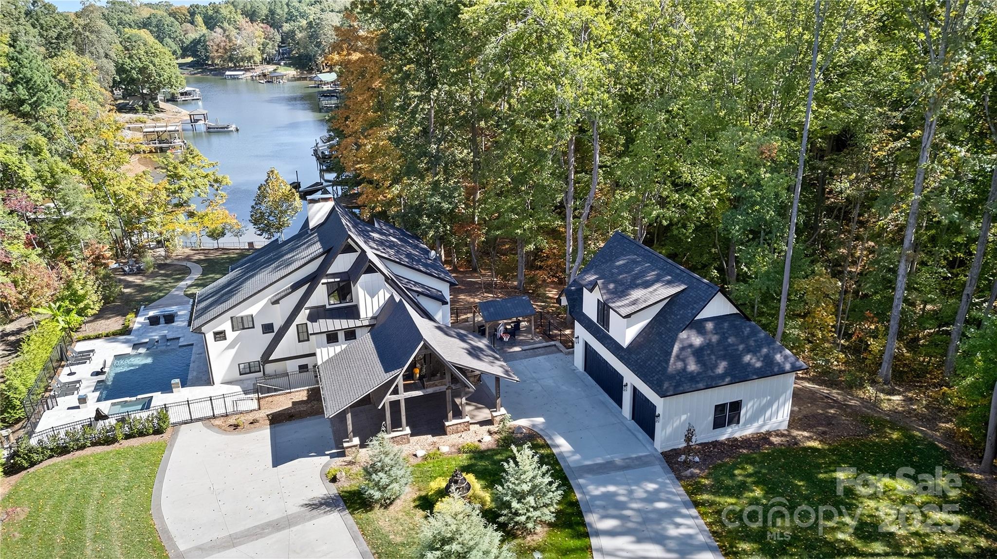 an aerial view of houses with backyard