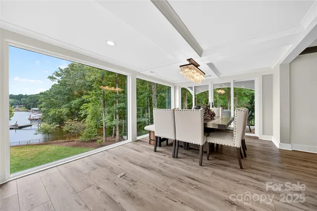 a living room with furniture a table and chairs