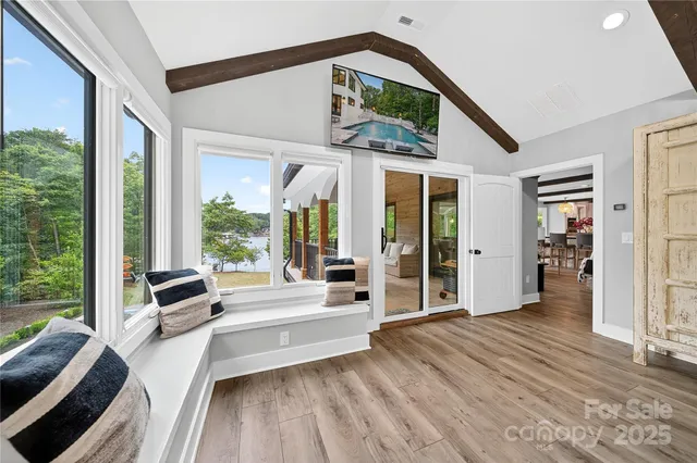 a large kitchen with stainless steel appliances granite countertop a sink and cabinets