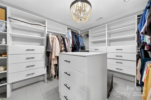 a balcony with furniture and a ceiling fan