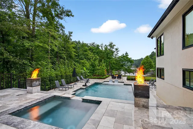 a view of a swimming pool with chairs