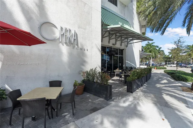 a view of a chairs and table in backyard