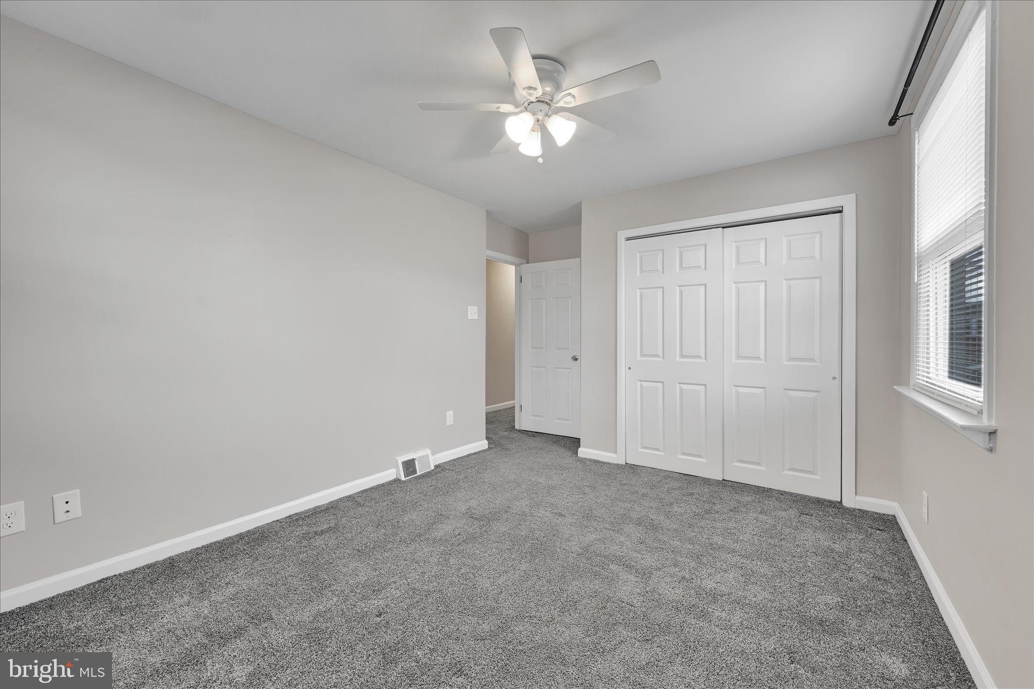 204 Ridley Avenue Folsom, PA 19033 - Photo 15 of 30 an empty room with chandelier fan and windows