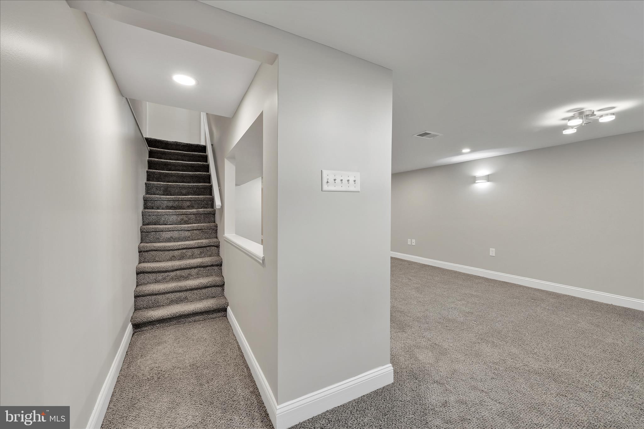 204 Ridley Avenue Folsom, PA 19033 - Photo 21 of 30 a view of hallway with stairs and wooden floor