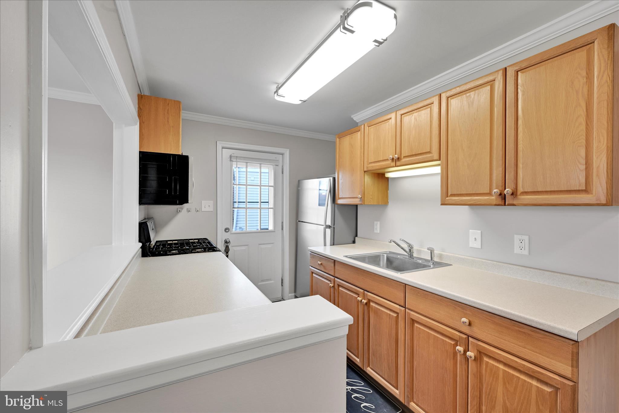 204 Ridley Avenue Folsom, PA 19033 - Photo 9 of 30 a kitchen that has a sink and a stove in it