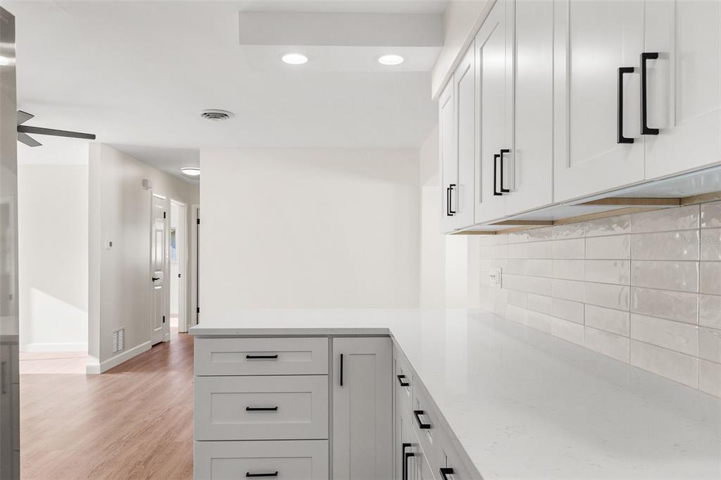 354 Burke Road Venice, FL 34293 - Photo 14 of 34 a view of a hallway with cabinets