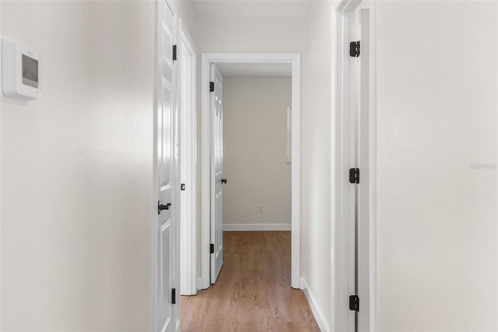 354 Burke Road Venice, FL 34293 - Photo 18 of 34 a view of a bathroom with a sink and mirror