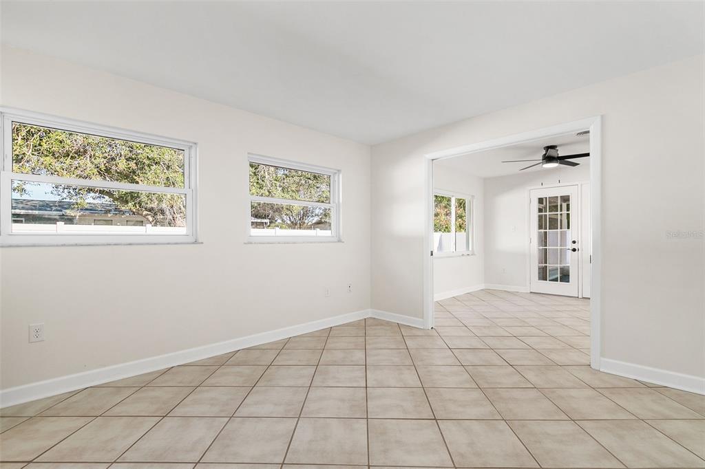 354 Burke Road Venice, FL 34293 - Photo 29 of 34 wooden floor in an empty room with a window