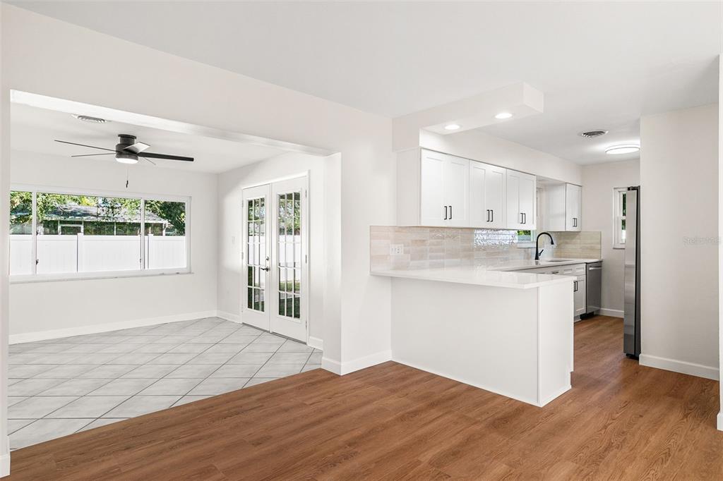 354 Burke Road Venice, FL 34293 - Photo 9 of 34 a kitchen with a refrigerator sink and cabinets
