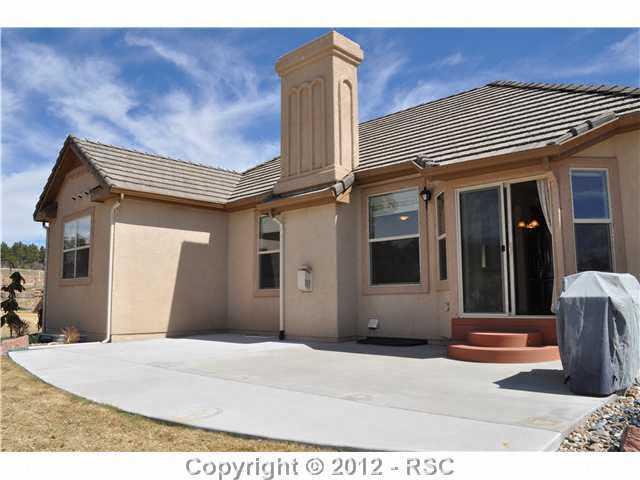 2844 Cinnabar Road Colorado Springs, CO 80921 - Photo 10 of 16 private back yard and an extended patio for outdoor entertaining or relax and enjoy the mountain views and Colorado sunsets!