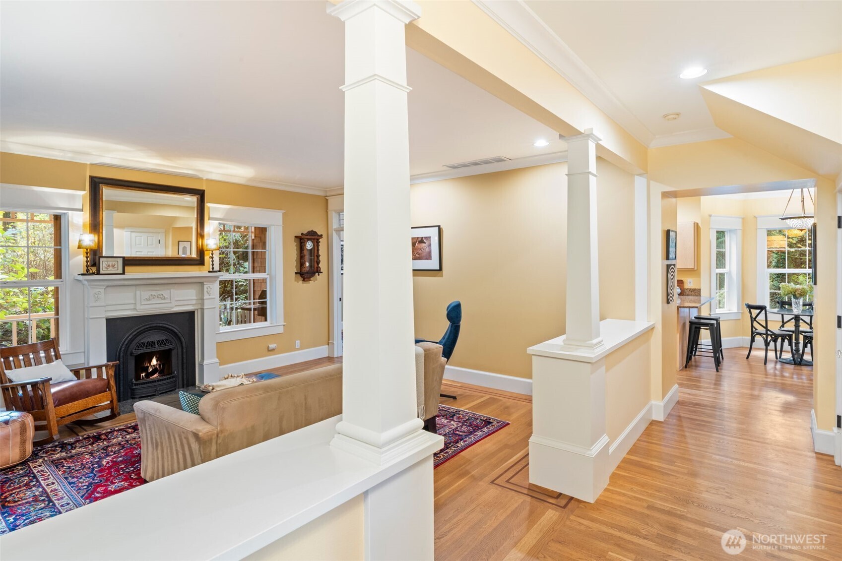 8991 Springwood Avenue Northeast Bainbridge Island, WA 98110 - Photo 12 of 36 a living room with furniture and a fireplace