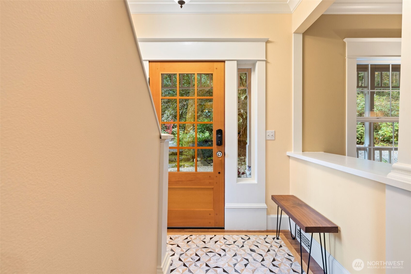 8991 Springwood Avenue Northeast Bainbridge Island, WA 98110 - Photo 13 of 36 a window and a table in a wooden floor