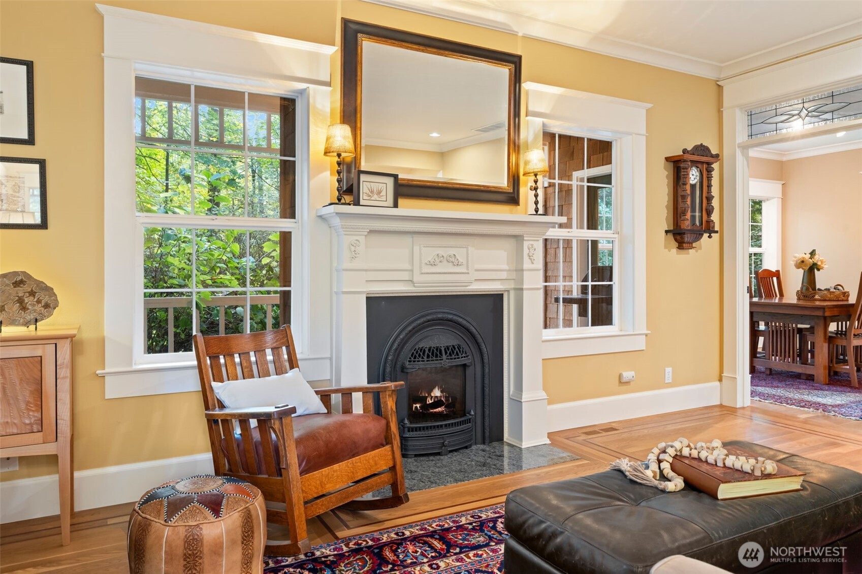 8991 Springwood Avenue Northeast Bainbridge Island, WA 98110 - Photo 15 of 36 a living room with furniture and a fireplace