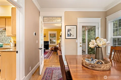 a view of entryway and hall with wooden floor