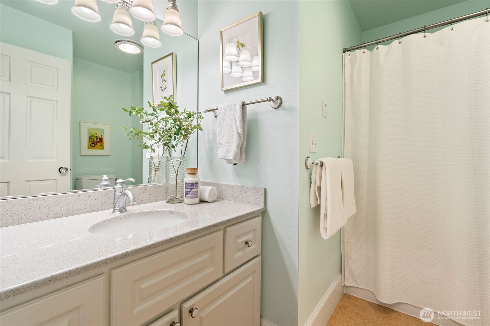 8991 Springwood Avenue Northeast Bainbridge Island, WA 98110 - Photo 30 of 36 a bathroom with a sink and a mirror