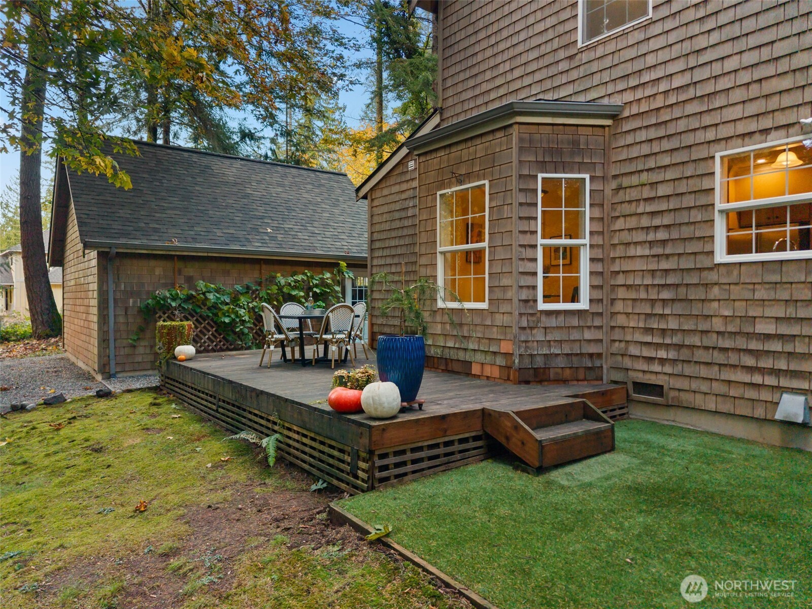 8991 Springwood Avenue Northeast Bainbridge Island, WA 98110 - Photo 33 of 36 a view of a backyard with plants and a patio