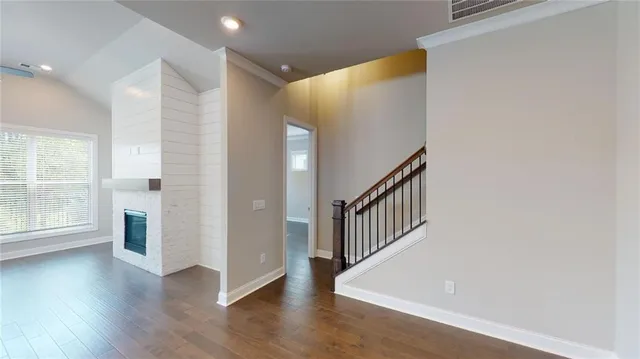 a view of an entryway with wooden floor