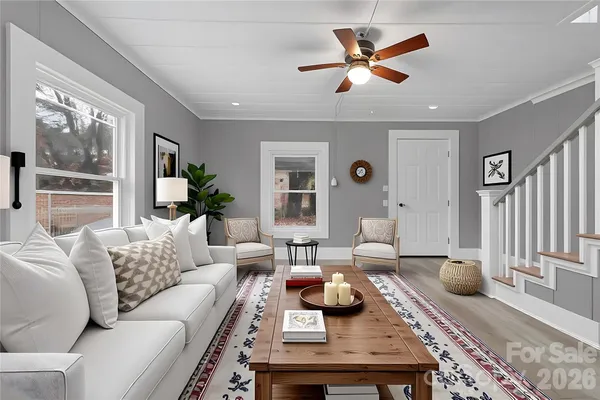 a view of kitchen with cabinets microwave and stove