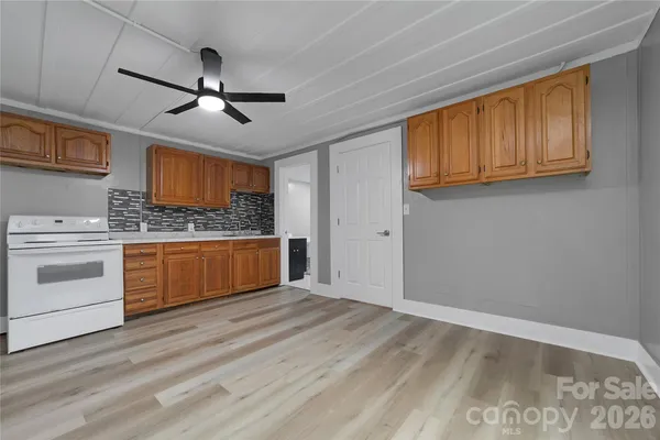 a kitchen with stainless steel appliances granite countertop a refrigerator stove a sink and dishwasher