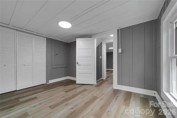 a view of wooden floor and brick walls