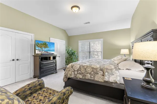 a bedroom with a bed and furniture