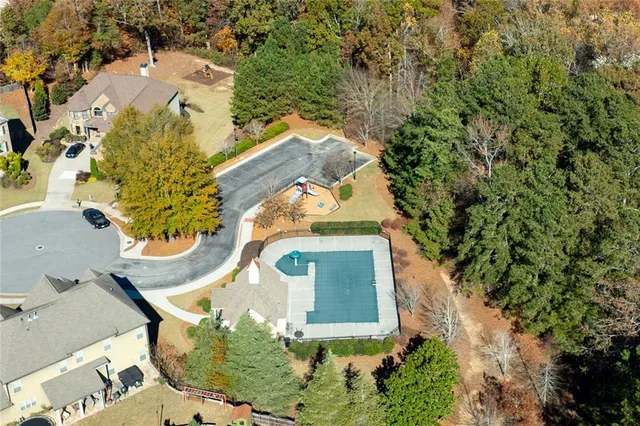 an aerial view of a house with a yard and garden view
