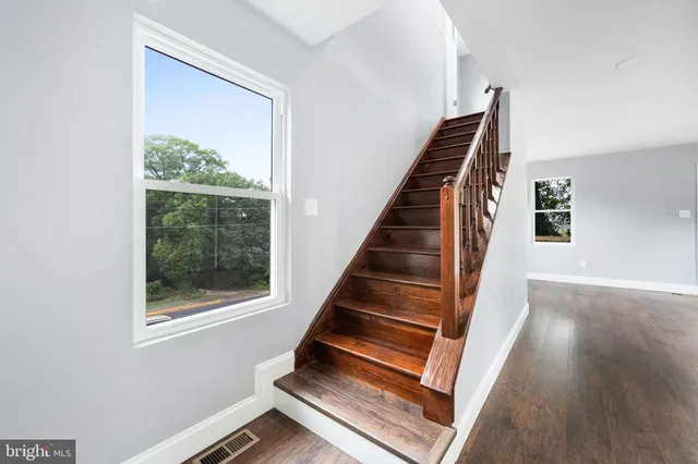 a view of an entryway with wooden floor