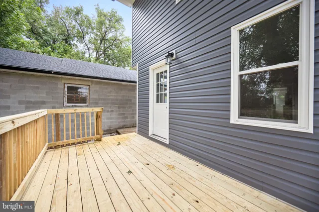 a view of backyard with a deck