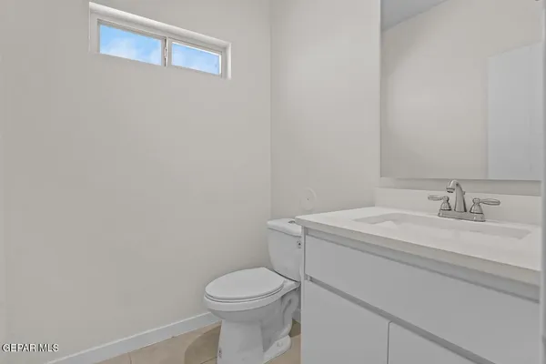 a kitchen with stainless steel appliances kitchen island granite countertop a refrigerator and a stove top oven