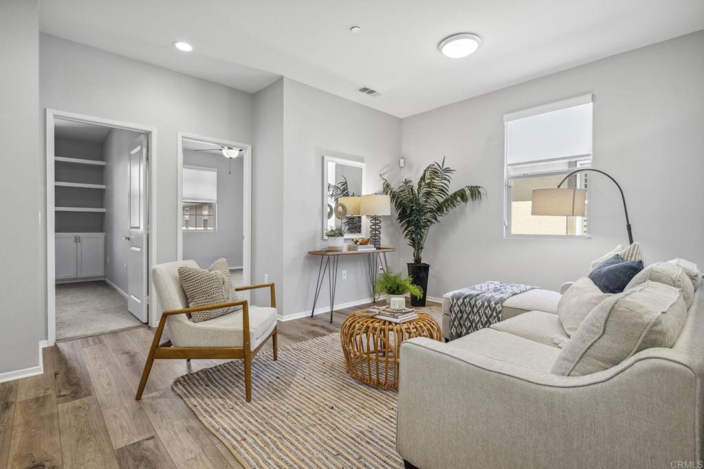 1167 Via Lucero Oceanside, CA 92056 - Photo 19 of 54 a living room with furniture and a potted plant