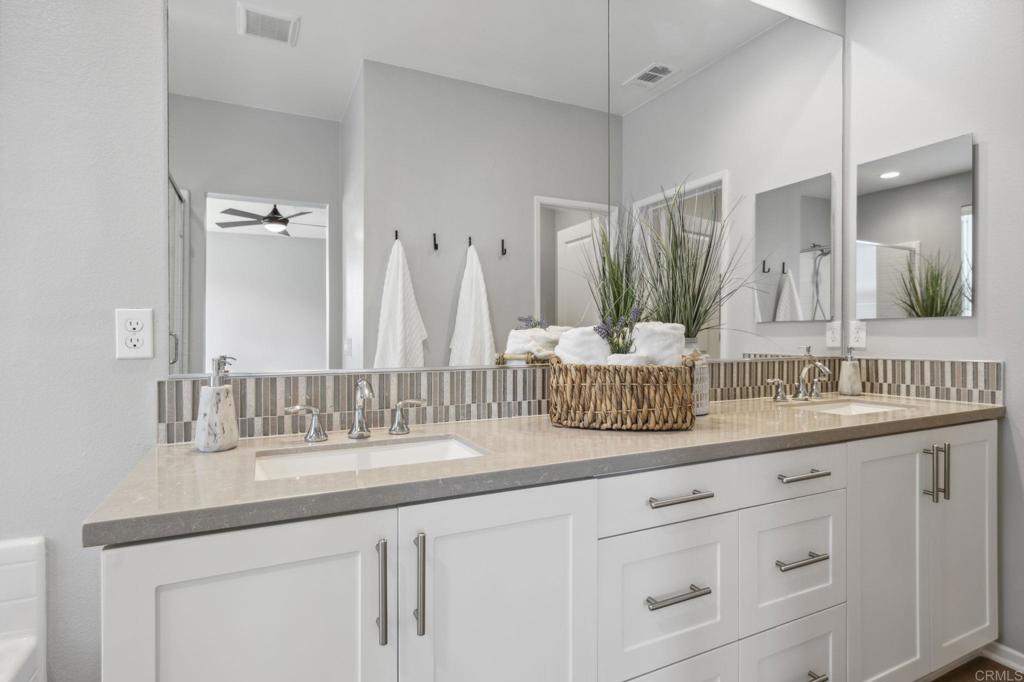 1167 Via Lucero Oceanside, CA 92056 - Photo 33 of 54 a bathroom with sink and mirror
