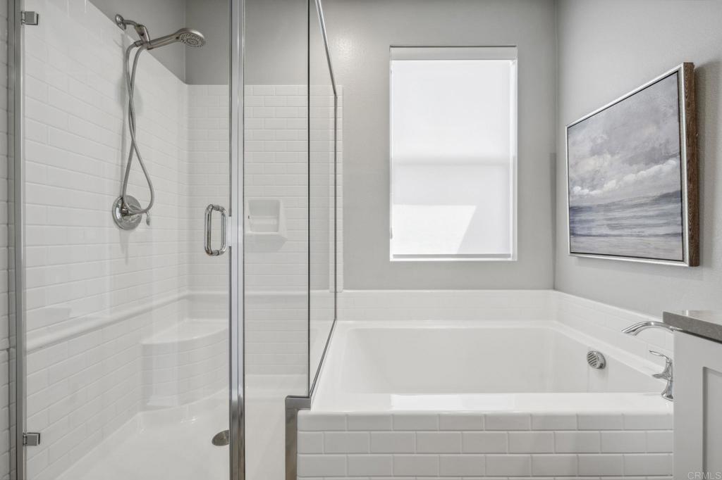 1167 Via Lucero Oceanside, CA 92056 - Photo 35 of 54 a bathroom with a bath tub and a shower