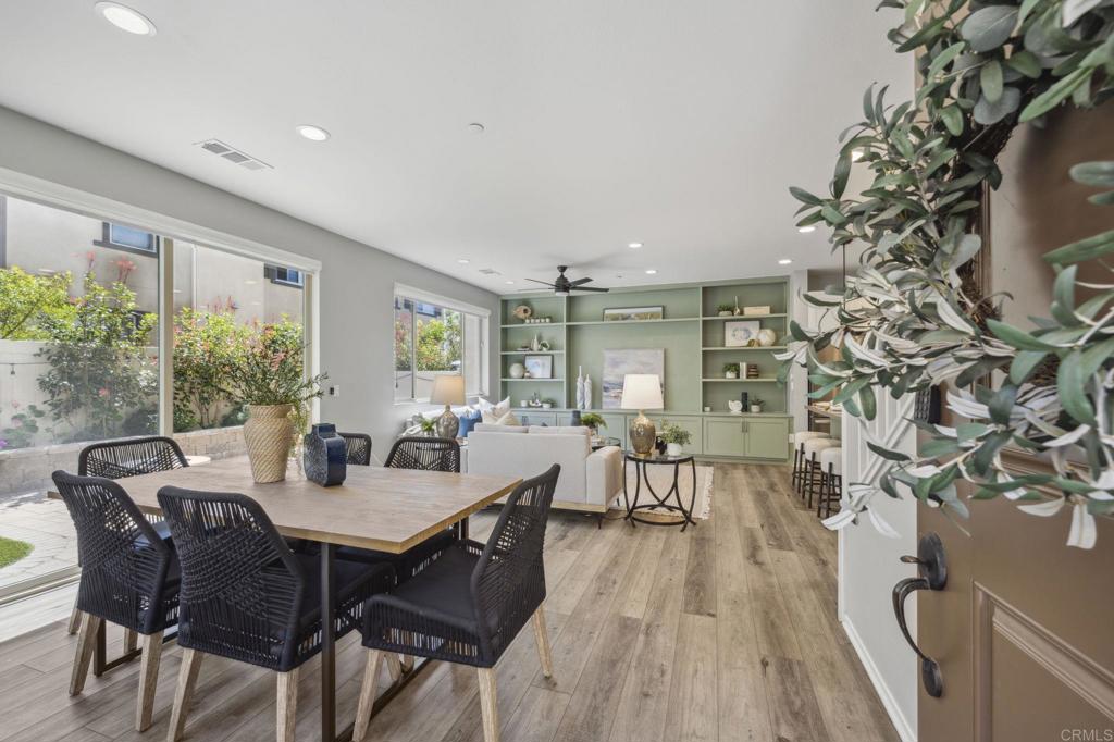 1167 Via Lucero Oceanside, CA 92056 - Photo 4 of 54 a view of a dining room with furniture window and wooden floor