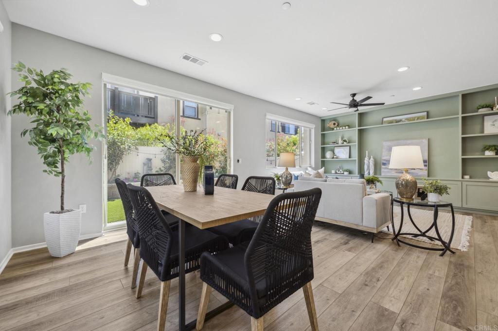 1167 Via Lucero Oceanside, CA 92056 - Photo 5 of 54 a view of a dining room with furniture and wooden floor